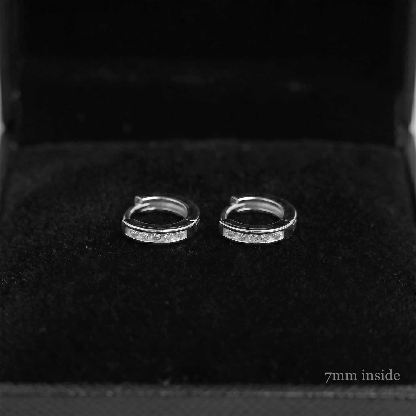 Channel Huggie Hoop earrings, rhodium silver with clear stone row; 7mm inside