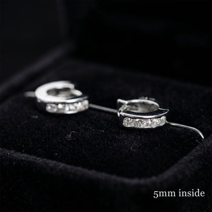 Rhodium Channel Huggie Hoops pair, curved bands with clear stones