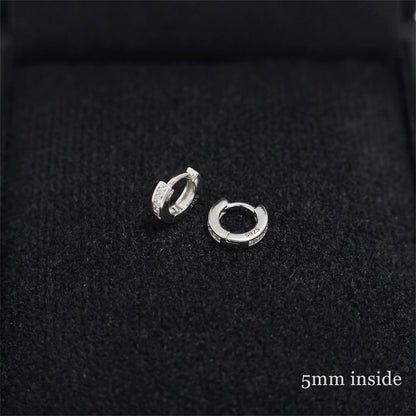 Rhodium Channel Huggie Hoops inner view: oval hoop with clear stone row