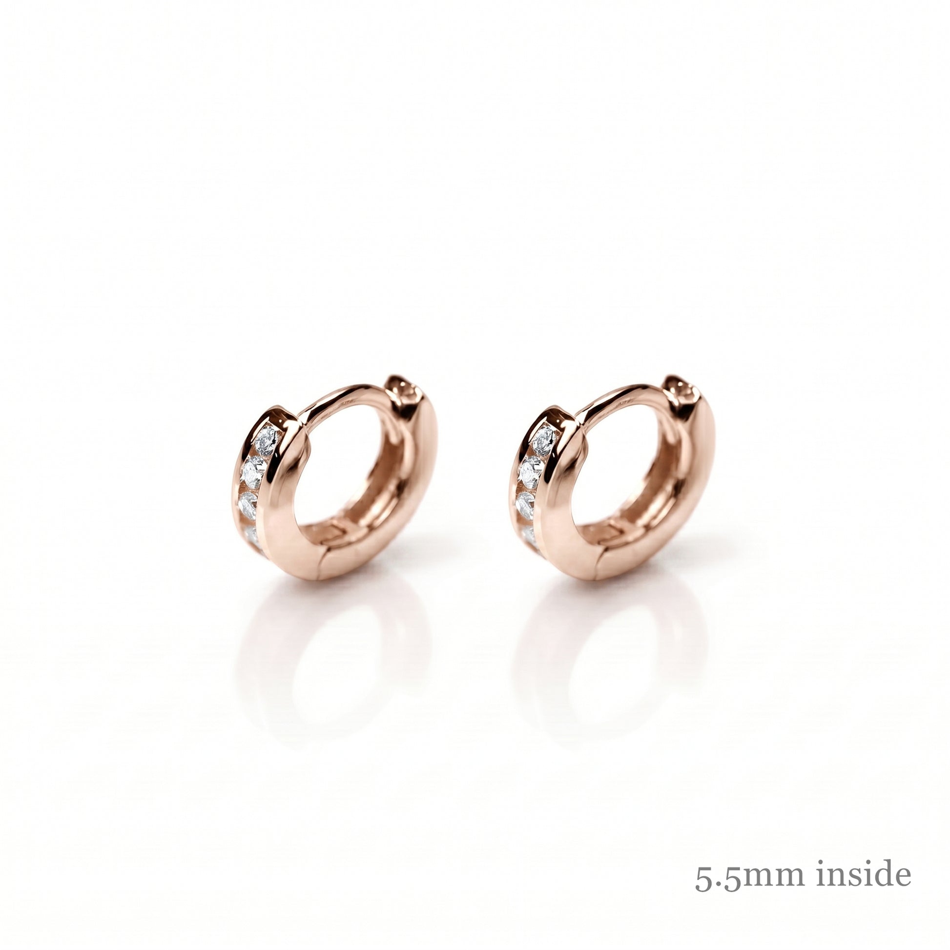 Rose Gold Channel Huggie Hoops with clear stones on the front bands