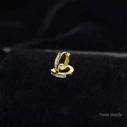 Channel Huggie Hoop earring, gold tone with clear stones; 7mm inside close-up