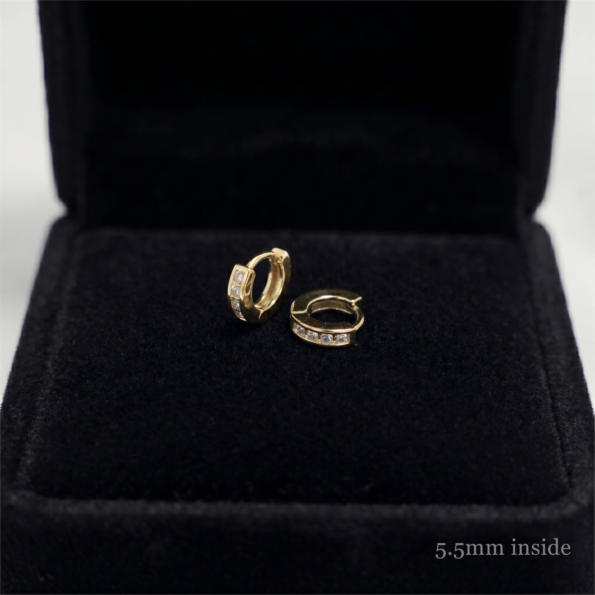 Channel Huggie Hoop earrings, gold tone with clear stones; 5.5mm inside
