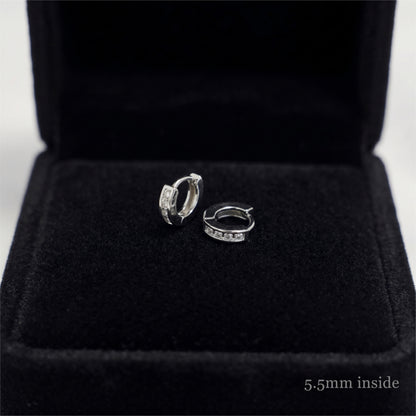 Rhodium Channel Huggie Hoops pair with open hinge and clear stones