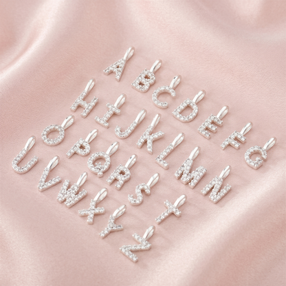 Mini alphabet letter charms with sparkling rhinestones, multiple letters on display