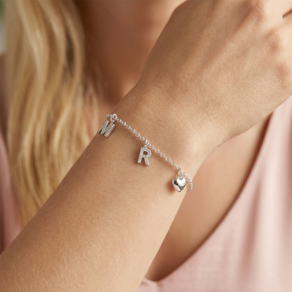 Charm bracelet with letter M and R mini alphabet charms and a heart charm