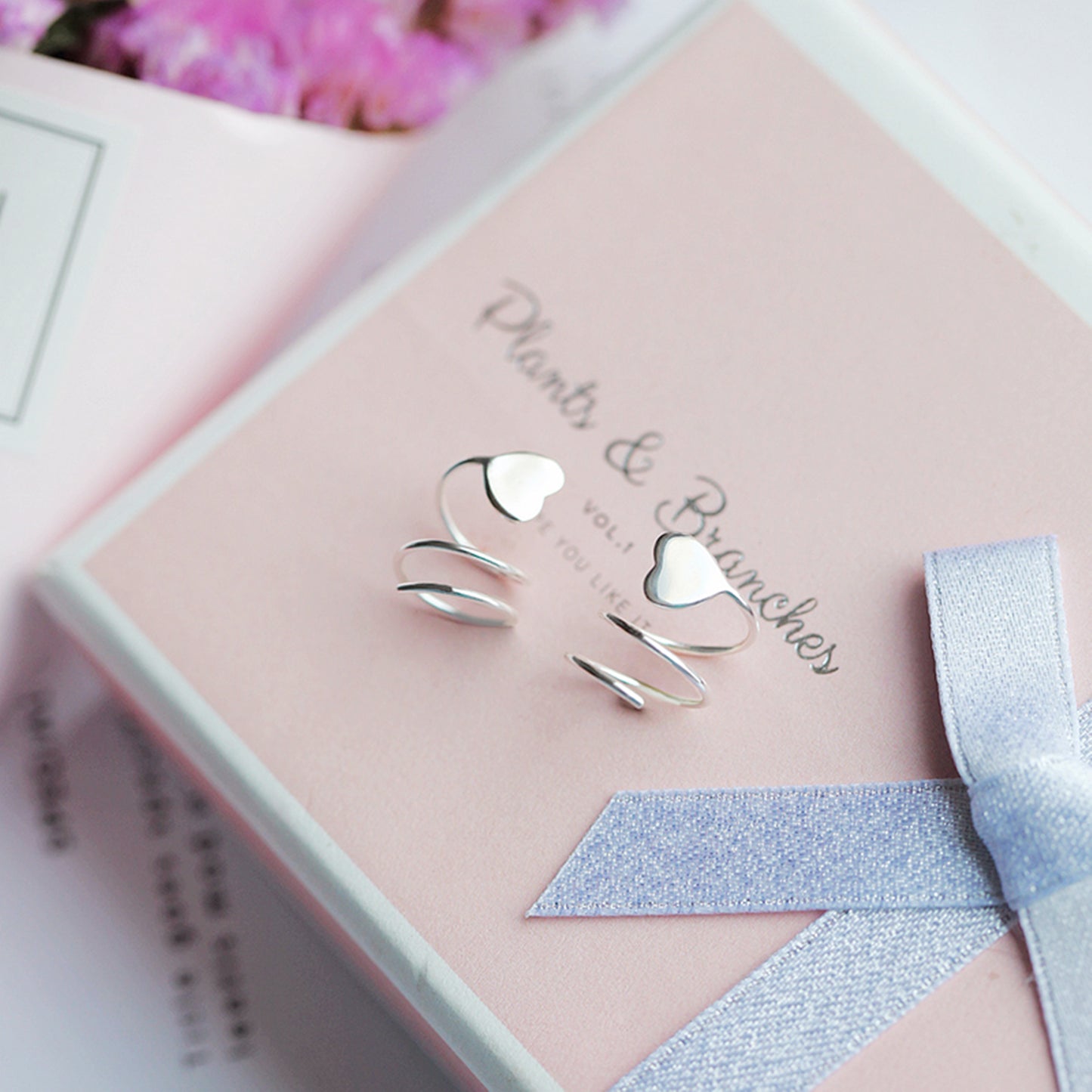 Sterling Silver Heart Twirl Huggie Earrings with Reverse Worn Wire - sugarkittenlondon