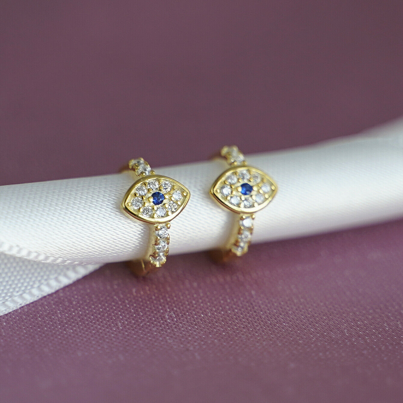 8mm Hoop Earrings with 18K Gold Finish and Blue White CZ Evil Eye Charm - sugarkittenlondon