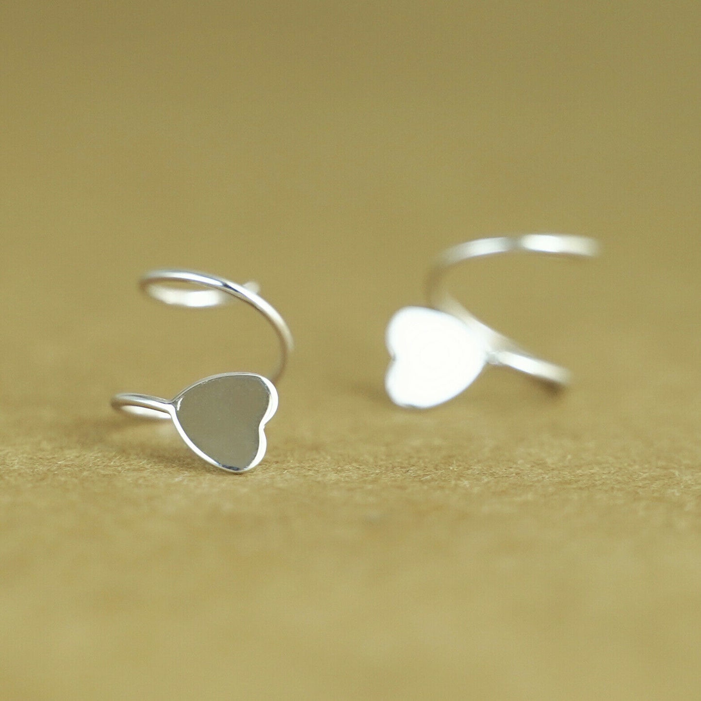 Sterling Silver Heart Twirl Huggie Earrings with Reverse Worn Wire - sugarkittenlondon