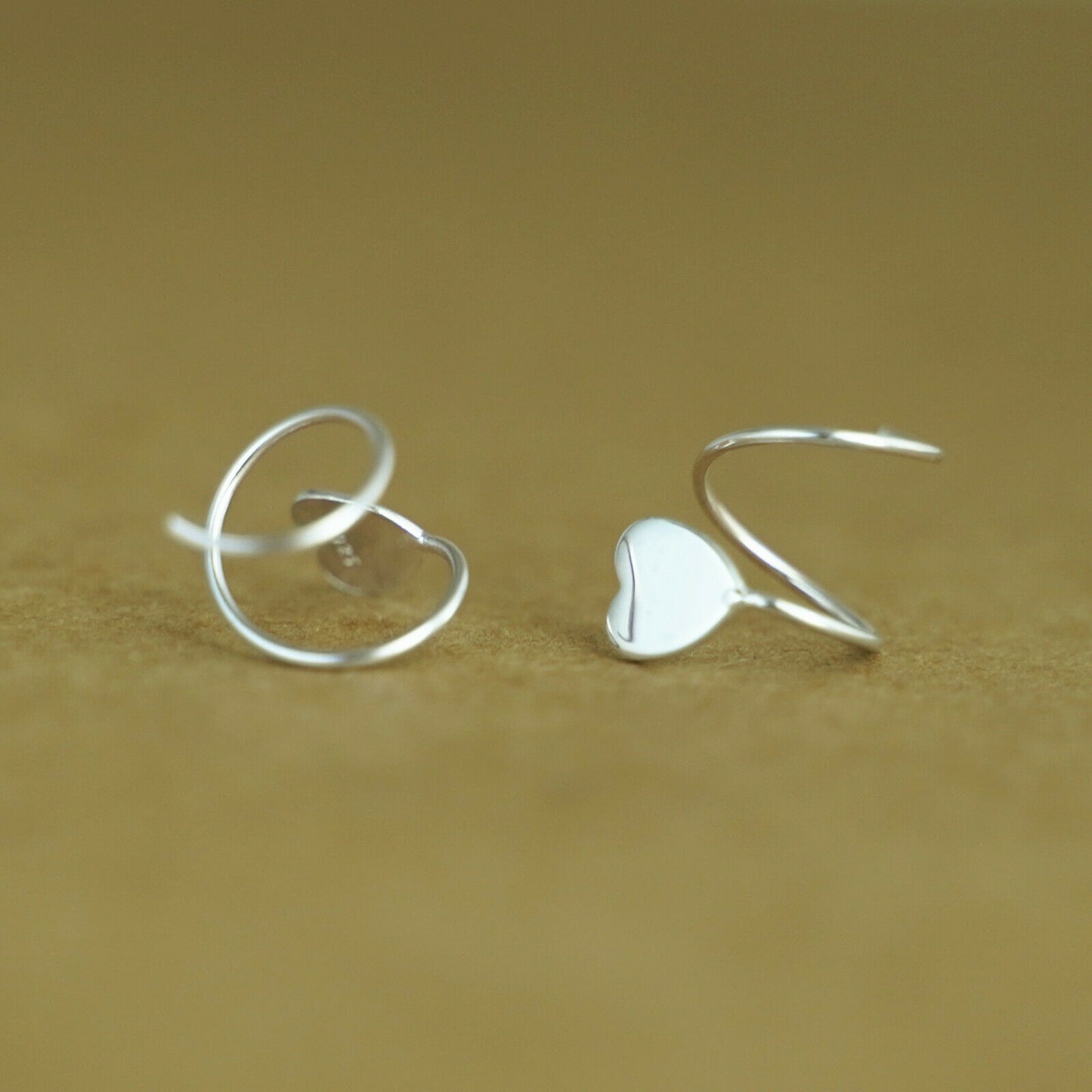 Sterling Silver Heart Twirl Huggie Earrings with Reverse Worn Wire - sugarkittenlondon