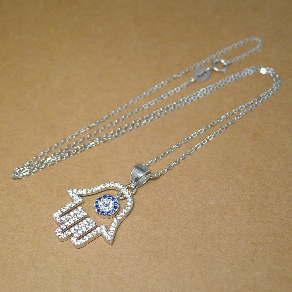 Sterling Silver Blue Paved CZ Evil Eye Hamsa Hand of Fatima Pendant Necklace - sugarkittenlondon