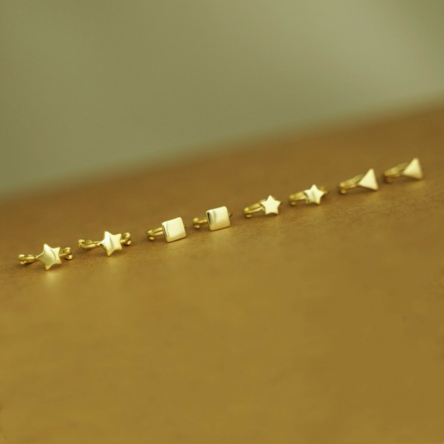 18K Gold Hinged Hoop Earrings with Mini Star, Square, and Triangle Shapes - sugarkittenlondon