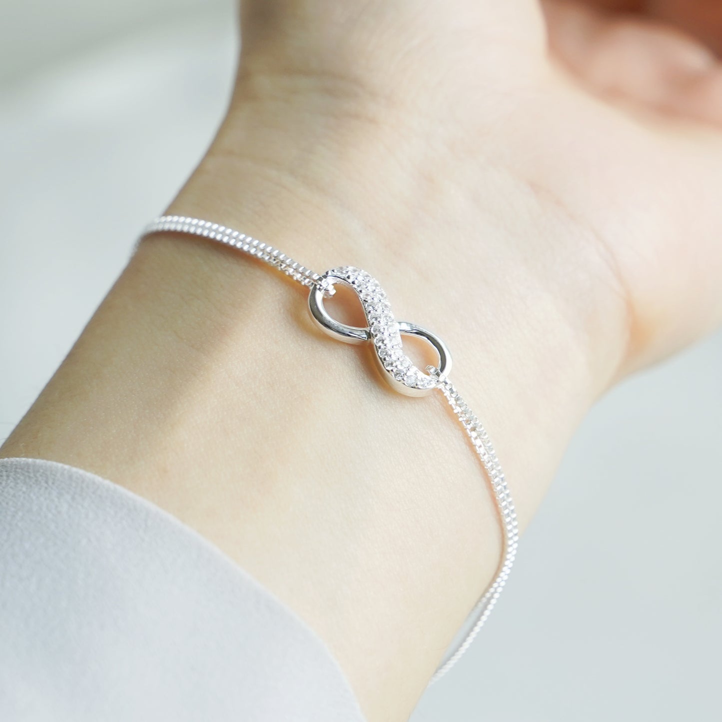 Sterling Silver Infinity Bracelet with Sparkling Crystal CZ - sugarkittenlondon